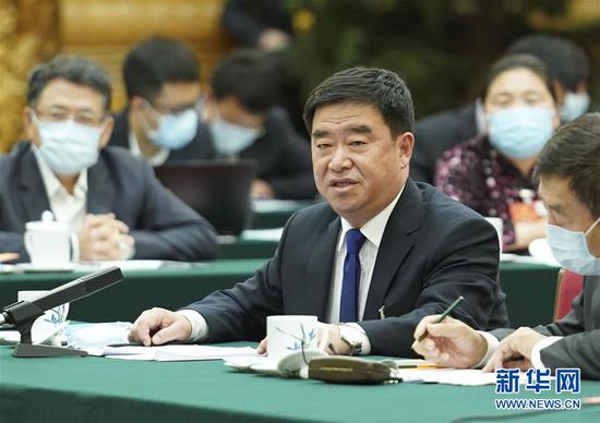 5月22日，全國人大代表薛志國參加內(nèi)蒙古代表團的審議并發(fā)言。新華社記者 黃敬文 攝